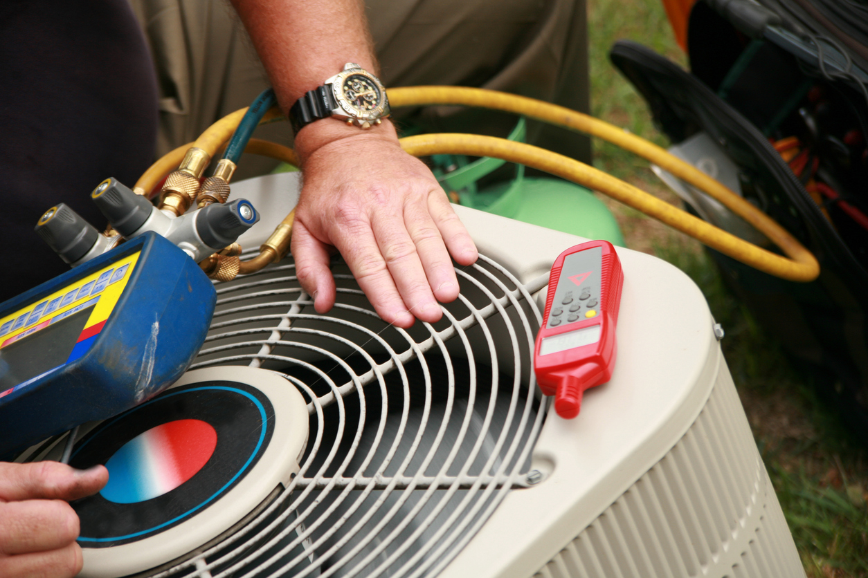 Technician and AC Unit