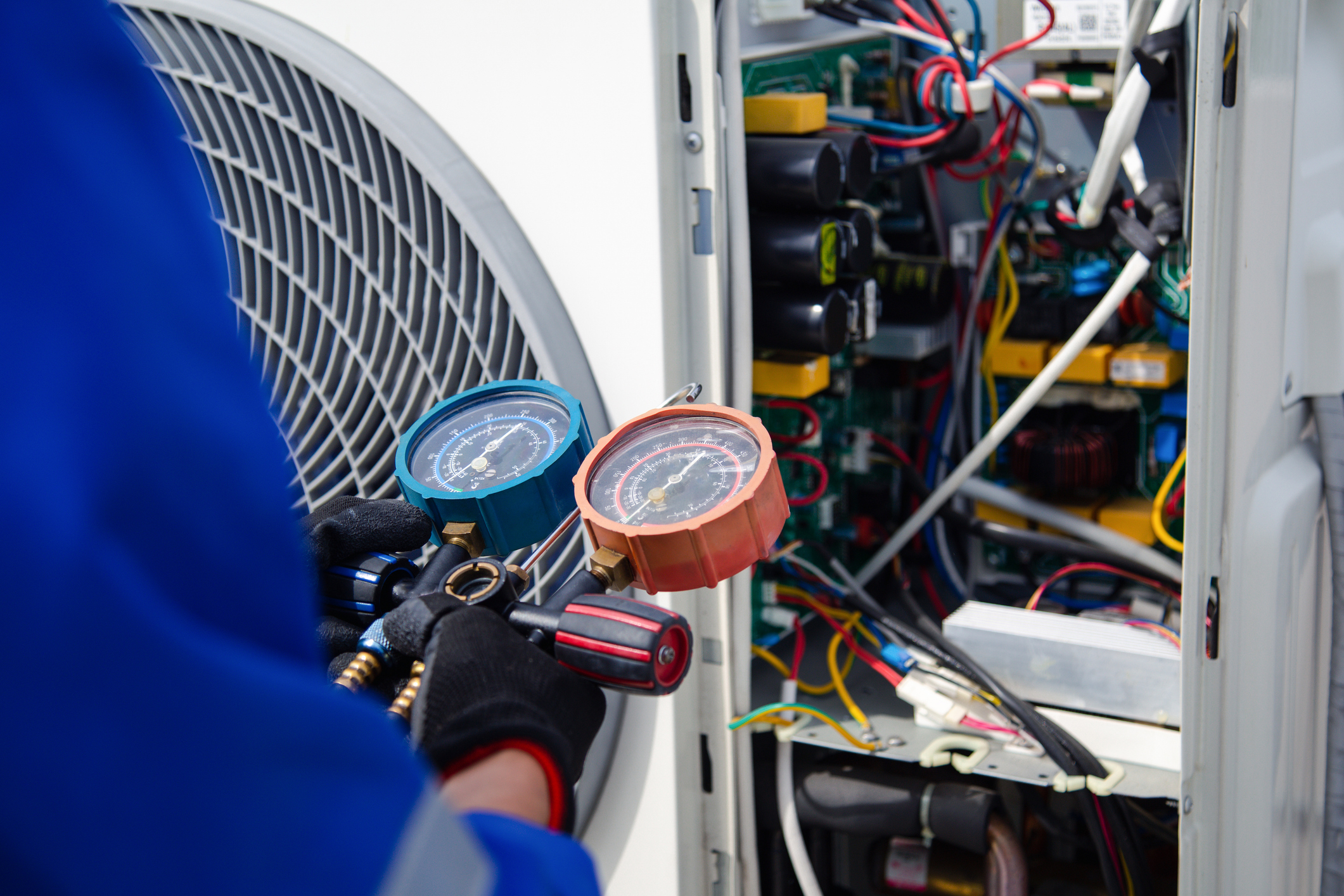 Technician Servicing AC Unit