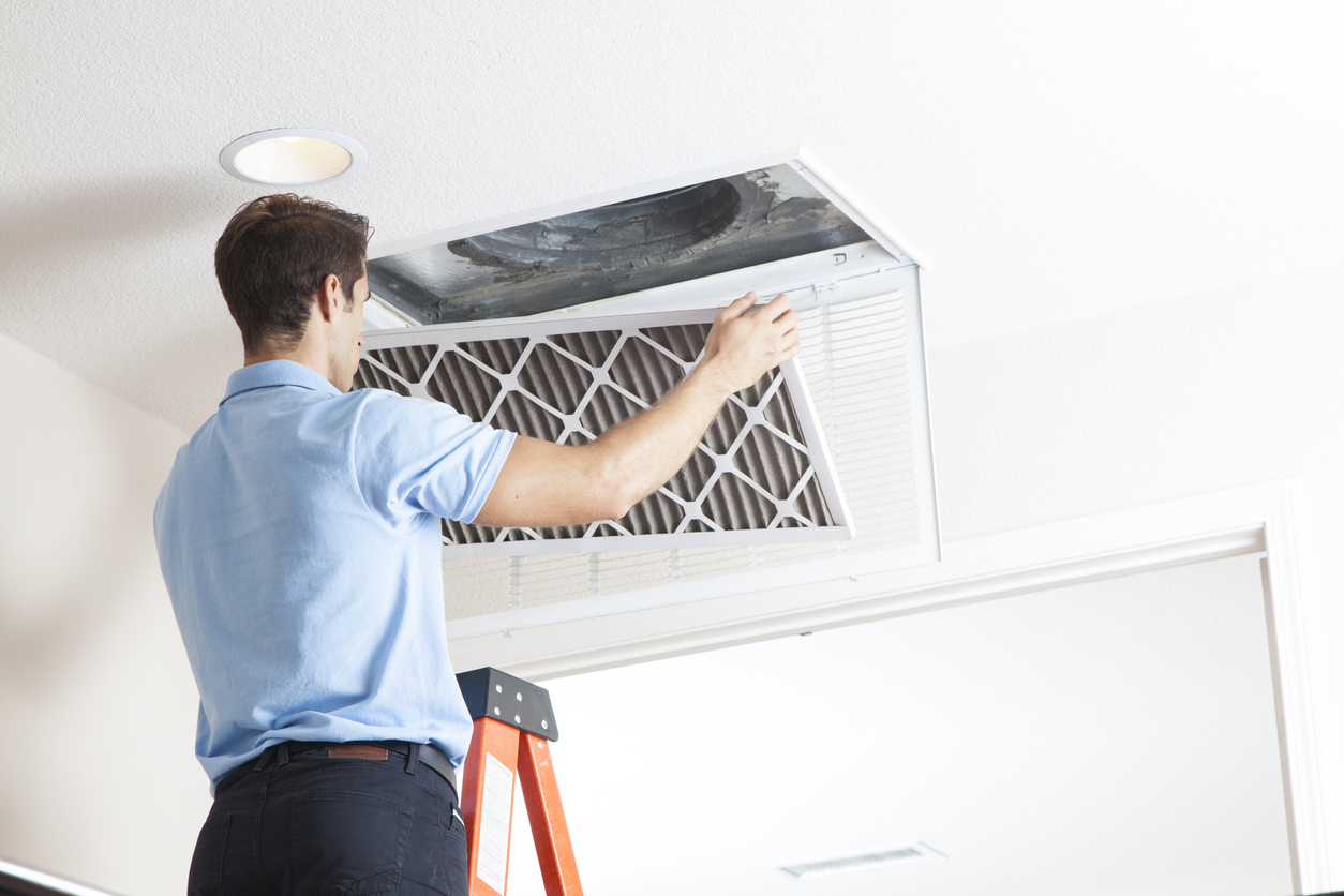 Technician Completing HVAC Services